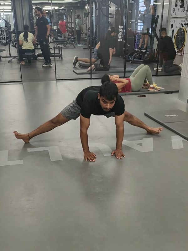 Student practising Wide-leg straddle balance